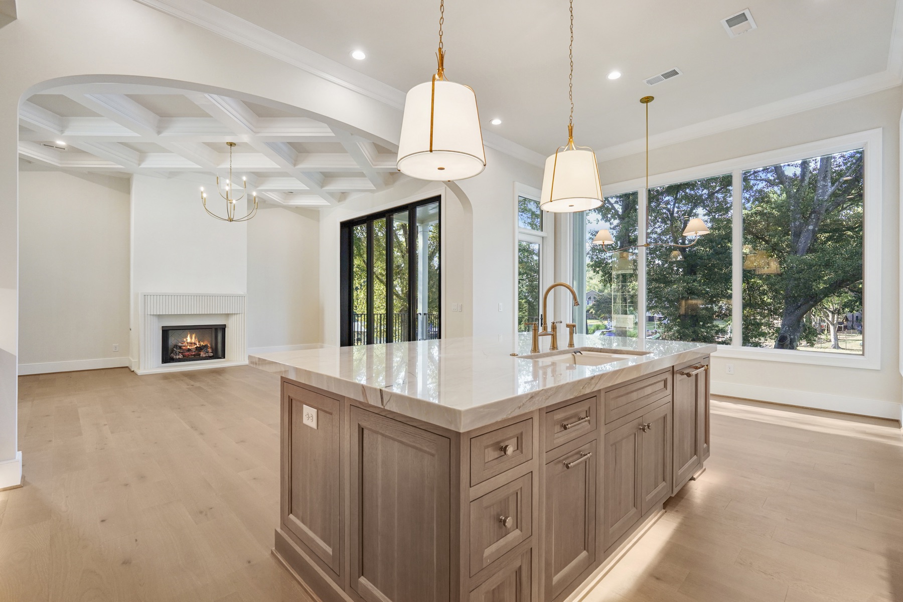 Open kitchen and living area with pendant lighting