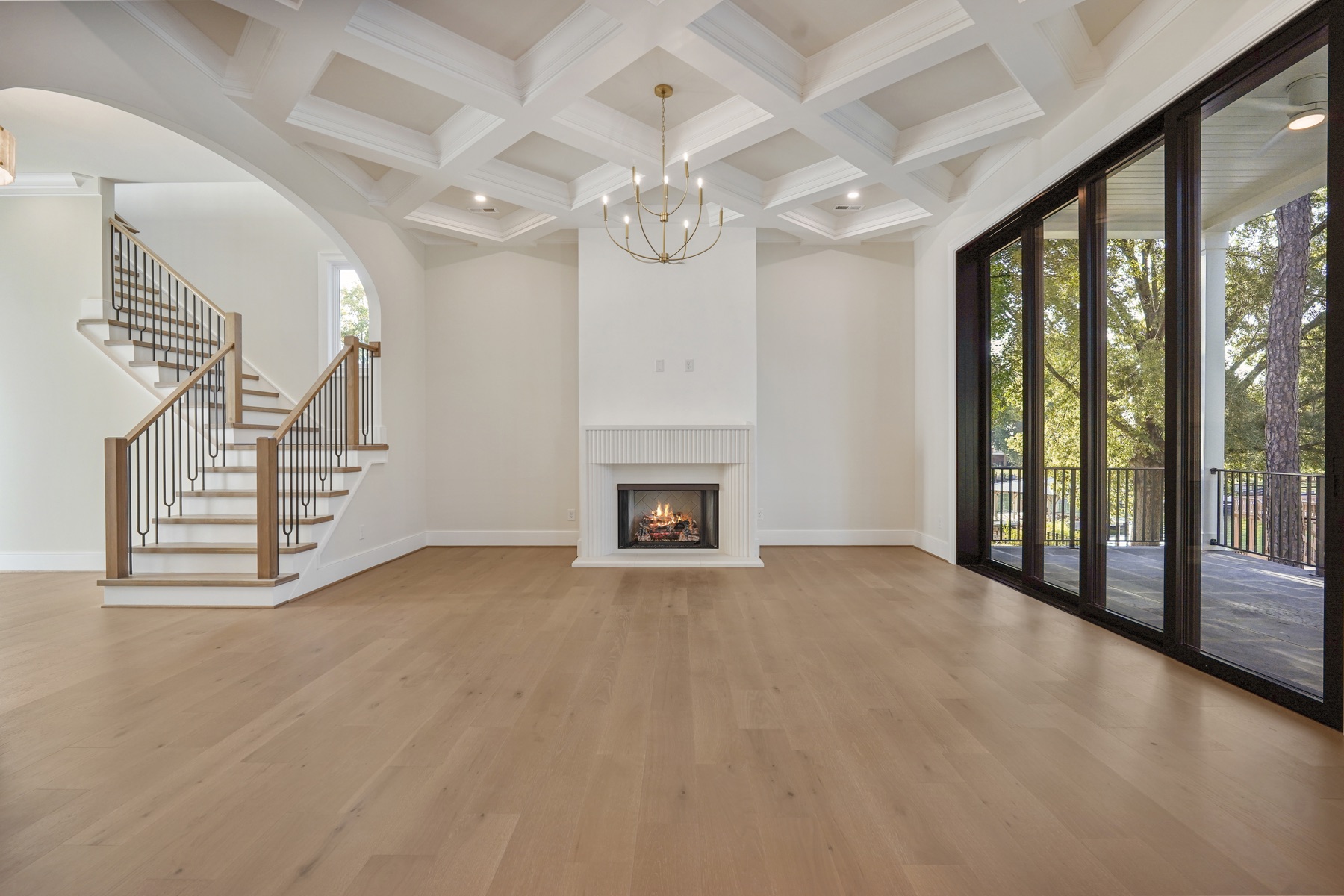 Living room with a fireplace and glass doors