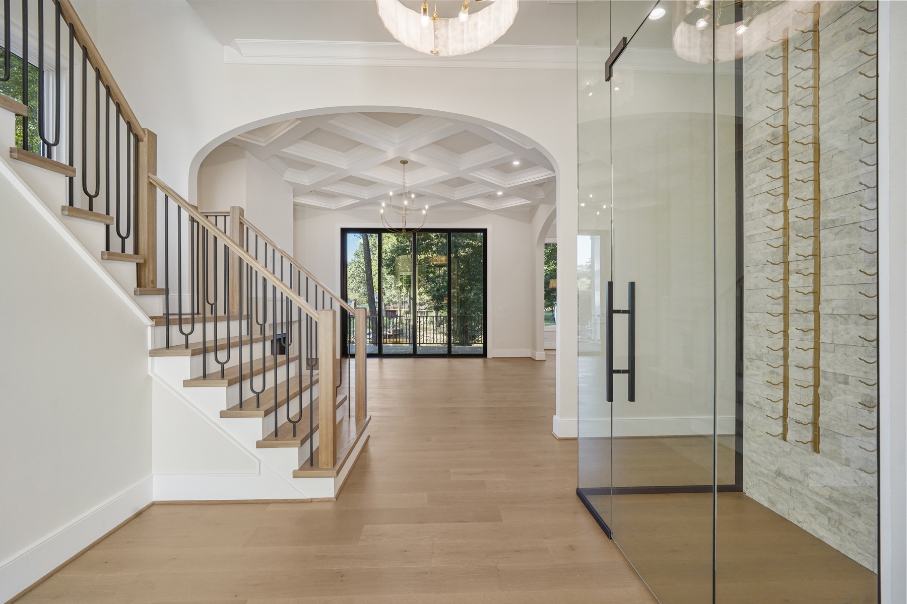 Staircase and foyer with wood floors