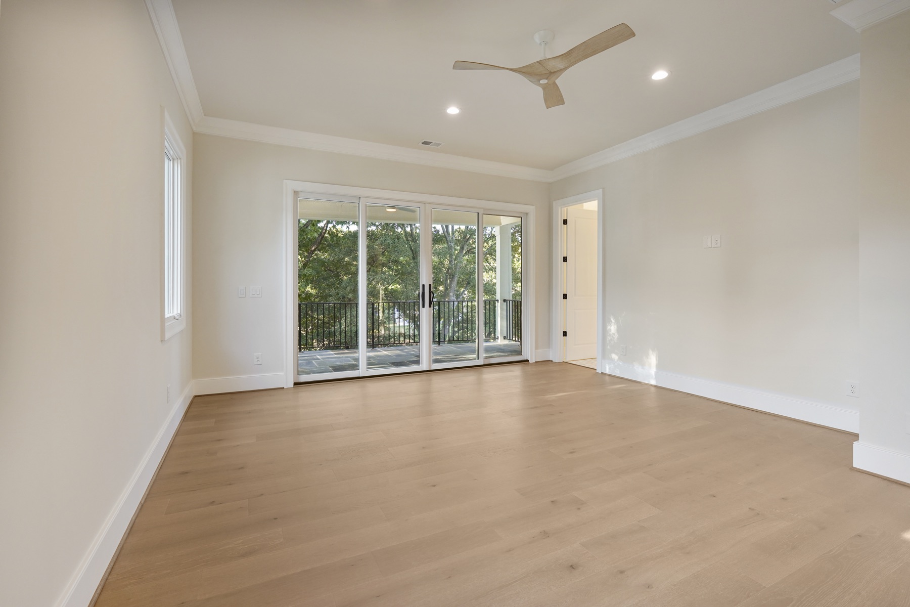Bedroom with lake-facing glass doors