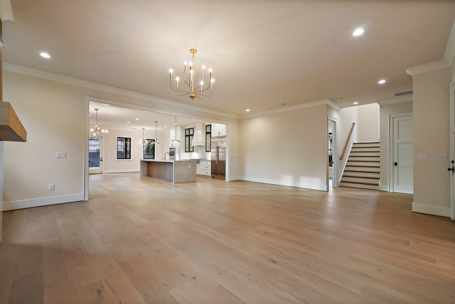 Open living area with a staircase and kitchen