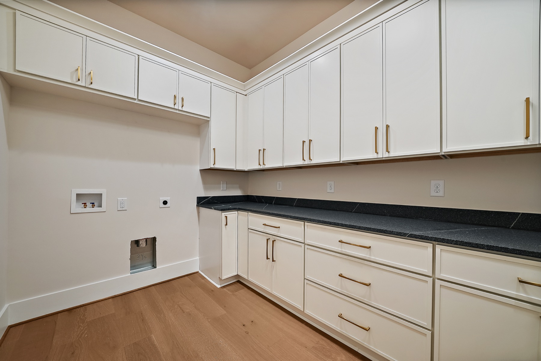 Another view of a walk-in closet with built-in storage