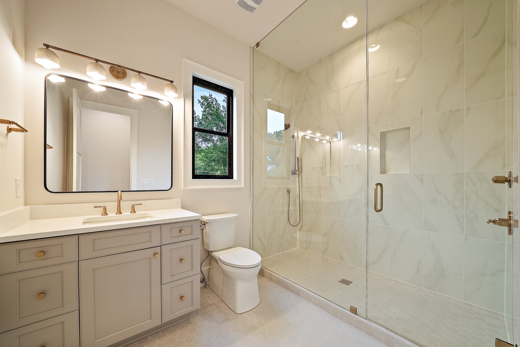 Laundry room with white cabinetry and dark countertops